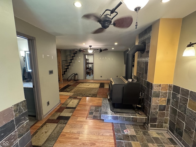 16952 Bookout Rd, Hagerstown, IN 47346 - living room with a wood stove, stairs, ceiling fan, and recessed lighting