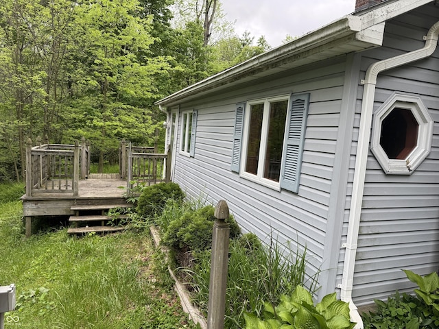 16952 Bookout Rd, Hagerstown, IN 47346 - view of side of home with a deck and a chimney