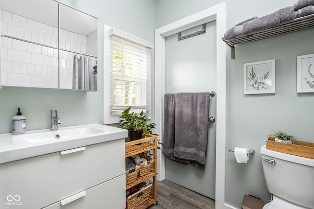 4414 Winthrop Ave, Indianapolis, IN 46205 - full bathroom with vanity, wood finished floors, toilet, and curtained shower