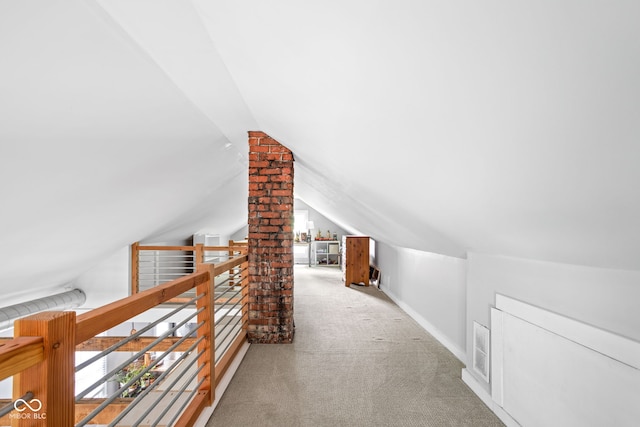 4414 Winthrop Ave, Indianapolis, IN 46205 - hall featuring lofted ceiling, carpet flooring, and an upstairs landing