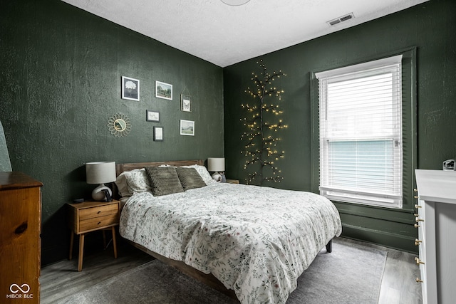 4414 Winthrop Ave, Indianapolis, IN 46205 - bedroom featuring wood finished floors and a textured wall
