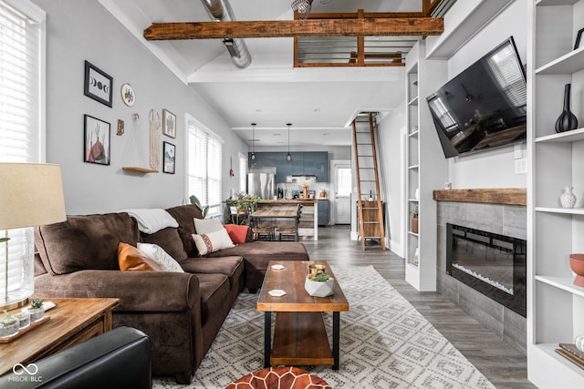 4414 Winthrop Ave, Indianapolis, IN 46205 - living area featuring wood finished floors, a fireplace, and beam ceiling