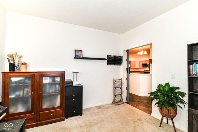 6556 Sulgrove Pl, Indianapolis, IN 46221 - sitting room with carpet floors, baseboards, and a chandelier