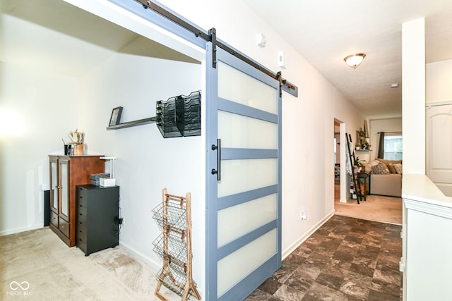 6556 Sulgrove Pl, Indianapolis, IN 46221 - foyer entrance with a barn door, baseboards, and carpet