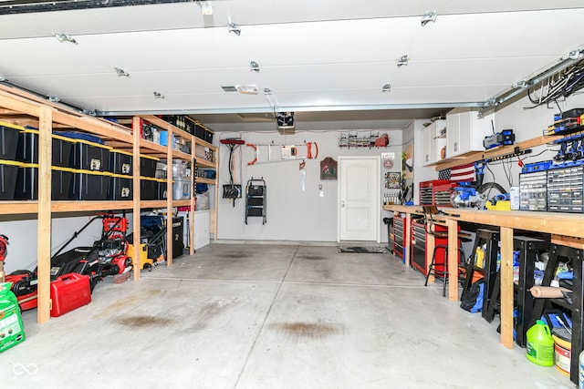 6556 Sulgrove Pl, Indianapolis, IN 46221 - garage featuring a workshop area and a garage door opener