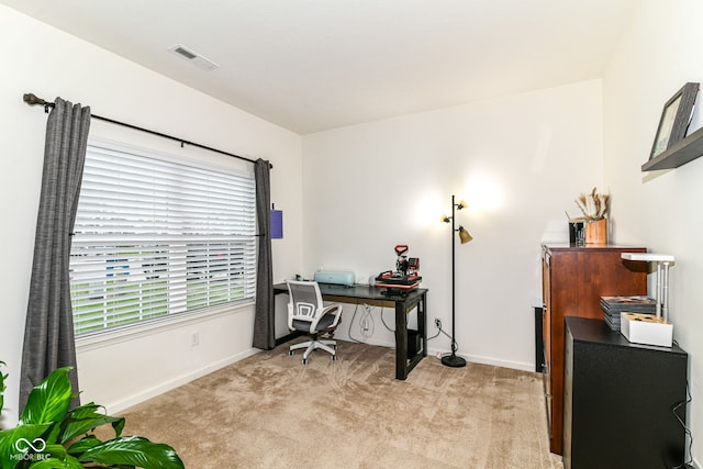 6556 Sulgrove Pl, Indianapolis, IN 46221 - office area featuring light carpet, baseboards, and plenty of natural light