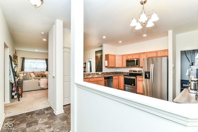 6556 Sulgrove Pl, Indianapolis, IN 46221 - kitchen featuring stainless steel appliances, a chandelier, recessed lighting, baseboards, and a sink