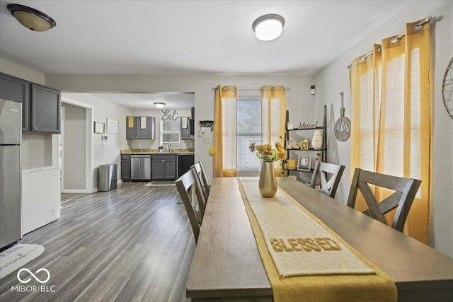 1907 N Drexel Ave, Indianapolis, IN 46218 - dining area featuring dark wood-style floors and baseboards