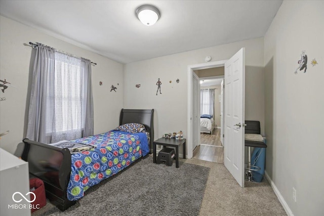 1907 N Drexel Ave, Indianapolis, IN 46218 - carpeted bedroom featuring baseboards
