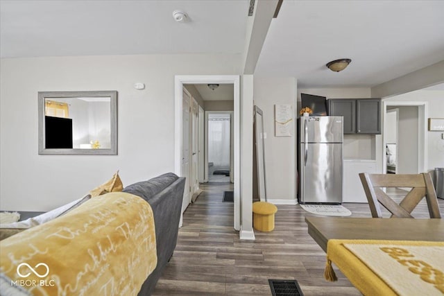 1907 N Drexel Ave, Indianapolis, IN 46218 - living room featuring dark wood finished floors and baseboards