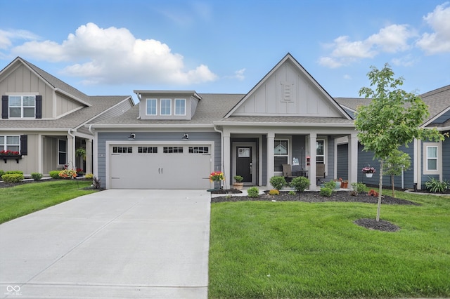 395 Ehrlich Ln, Westfield, IN 46074 - craftsman-style home featuring board and batten siding, an attached garage, a front lawn, and concrete driveway