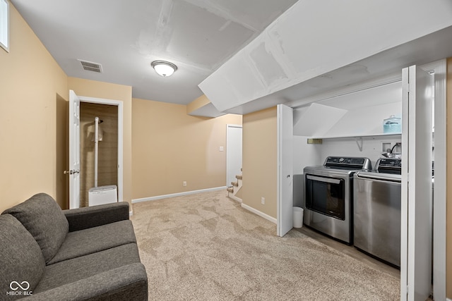 1438 Adams St, Lafayette, IN 47905 - kitchen featuring washer and dryer, light colored carpet, and baseboards