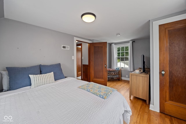 1438 Adams St, Lafayette, IN 47905 - bedroom featuring light wood-type flooring and baseboards