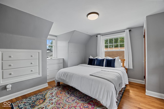 1438 Adams St, Lafayette, IN 47905 - bedroom featuring light wood finished floors, baseboards, and vaulted ceiling