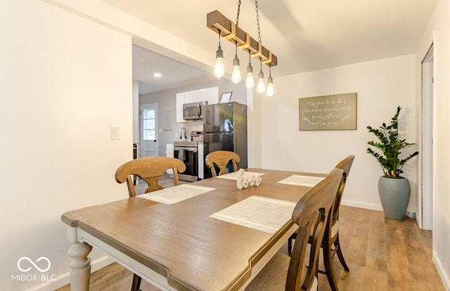 1398 Clinton St, Noblesville, IN 46060 - dining room featuring light wood-style flooring and baseboards