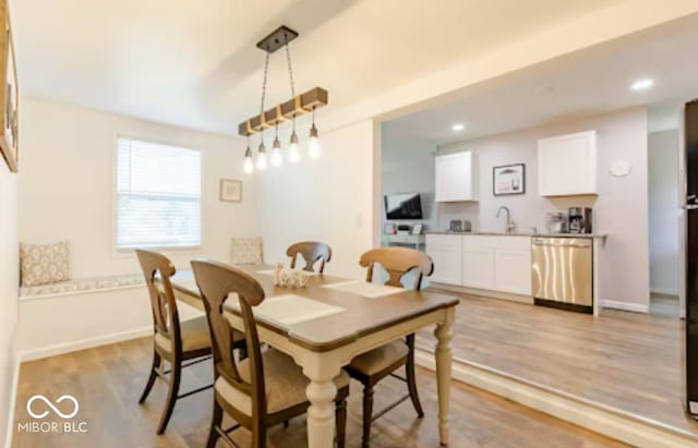 1398 Clinton St, Noblesville, IN 46060 - dining space featuring light wood-style flooring, baseboards, and recessed lighting