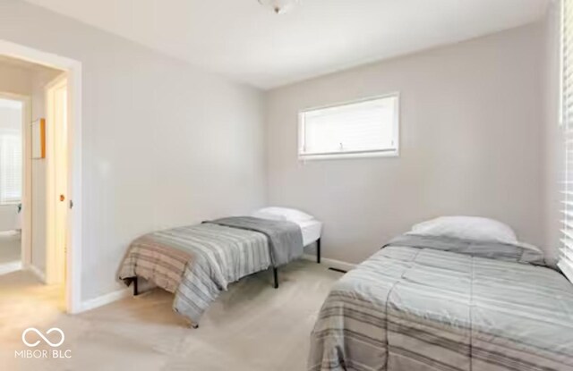 1398 Clinton St, Noblesville, IN 46060 - bedroom featuring baseboards and light carpet