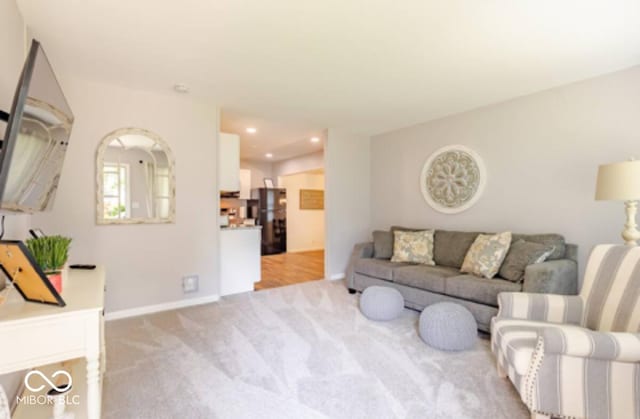 1398 Clinton St, Noblesville, IN 46060 - living room with light carpet, baseboards, and recessed lighting