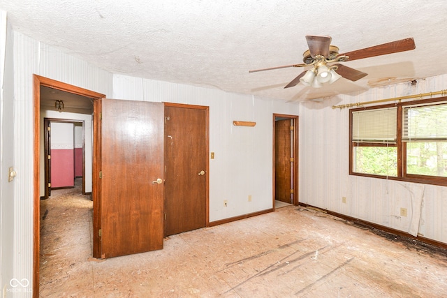 1113 Delray Dr, Indianapolis, IN 46241 - unfurnished room featuring a textured ceiling, ceiling fan, and baseboards