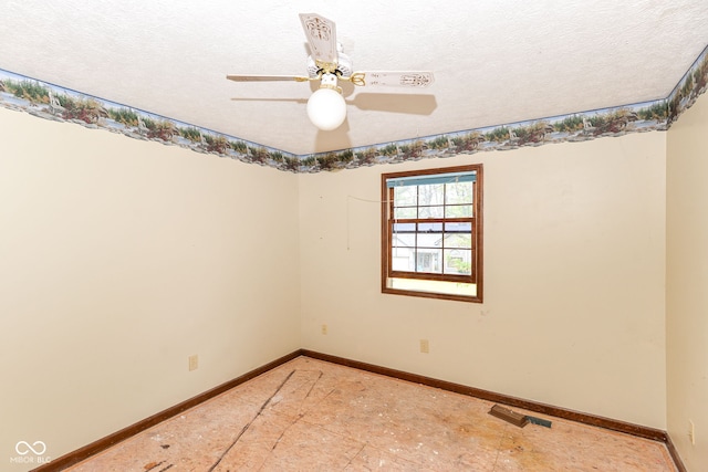 1113 Delray Dr, Indianapolis, IN 46241 - unfurnished room with baseboards, ceiling fan, and a textured ceiling
