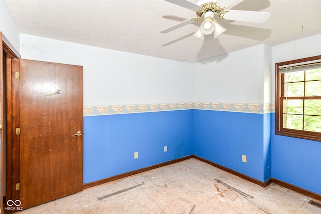 1113 Delray Dr, Indianapolis, IN 46241 - unfurnished room with a ceiling fan, a textured ceiling, and baseboards