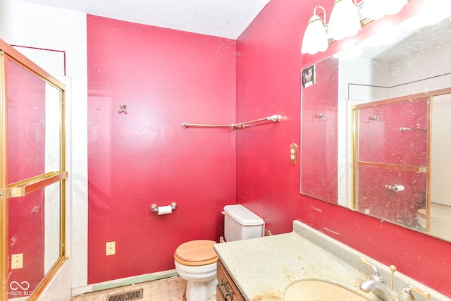 1113 Delray Dr, Indianapolis, IN 46241 - bathroom featuring toilet, an enclosed shower, vanity, a textured ceiling, and baseboards