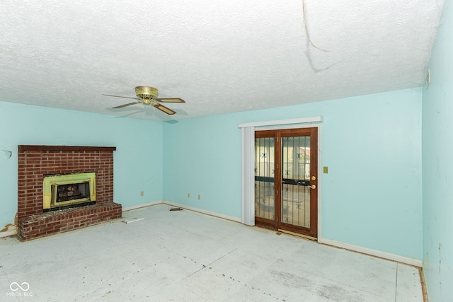 1113 Delray Dr, Indianapolis, IN 46241 - unfurnished living room featuring a ceiling fan, baseboards, a brick fireplace, and a textured ceiling