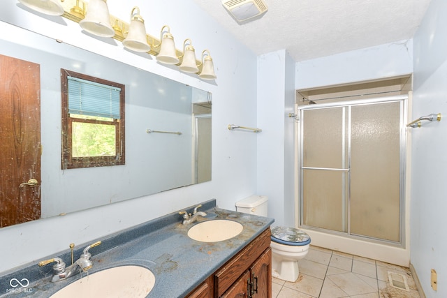 1113 Delray Dr, Indianapolis, IN 46241 - bathroom with toilet, a shower with door, double vanity, tile patterned floors, and a textured ceiling