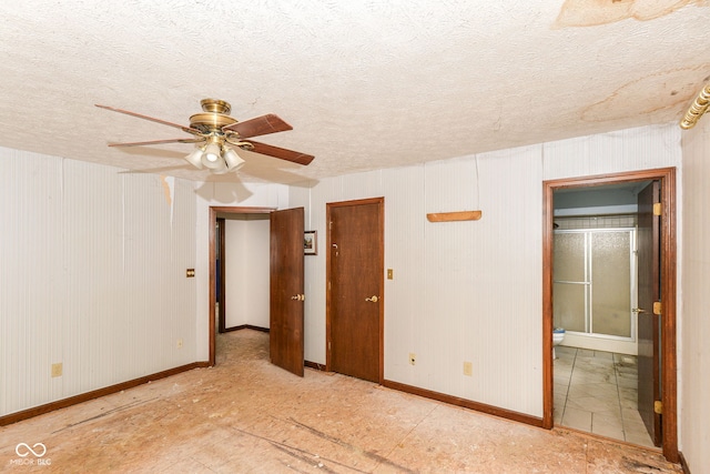 1113 Delray Dr, Indianapolis, IN 46241 - spare room with baseboards, ceiling fan, and a textured ceiling