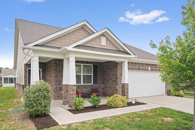 13321 N White Cloud Ct, Camby, IN 46113 - craftsman-style home with covered porch, brick siding, an attached garage, driveway, and a shingled roof