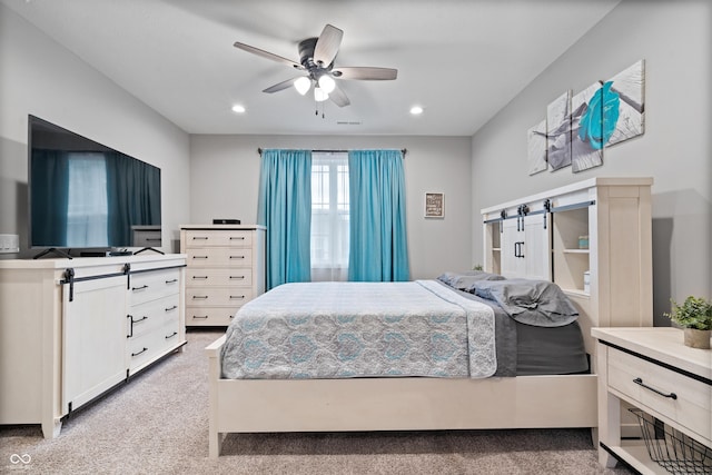 13321 N White Cloud Ct, Camby, IN 46113 - carpeted bedroom featuring a barn door, recessed lighting, and ceiling fan