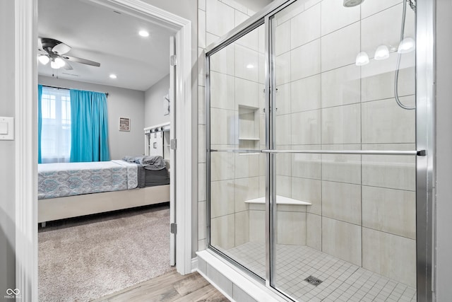 13321 N White Cloud Ct, Camby, IN 46113 - bathroom with connected bathroom, a shower stall, wood finished floors, ceiling fan, and recessed lighting