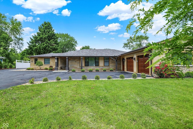126 E 86th St, Indianapolis, IN 46240 - single story home with a garage, asphalt driveway, a front lawn, and stone siding