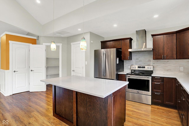 126 E 86th St, Indianapolis, IN 46240 - kitchen with wall chimney exhaust hood, appliances with stainless steel finishes, light wood-style floors, light countertops, and dark brown cabinets
