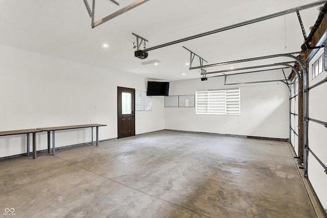 126 E 86th St, Indianapolis, IN 46240 - garage featuring a garage door opener and recessed lighting