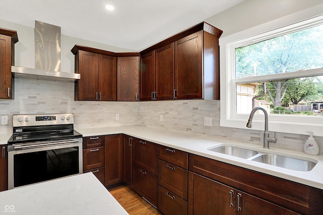 126 E 86th St, Indianapolis, IN 46240 - kitchen featuring wall chimney exhaust hood, electric range, a sink, light countertops, and decorative backsplash