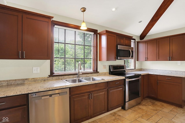 126 E 86th St, Indianapolis, IN 46240 - kitchen with appliances with stainless steel finishes, a sink, pendant lighting, light stone finish floors, and recessed lighting
