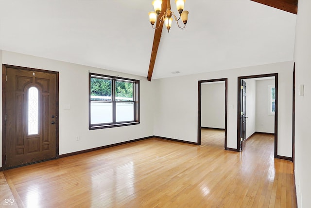 126 E 86th St, Indianapolis, IN 46240 - foyer entrance featuring a chandelier, light wood-style floors, and baseboards