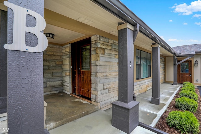 126 E 86th St, Indianapolis, IN 46240 - entrance to property featuring stone siding