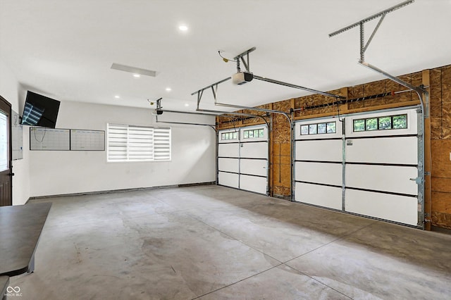 126 E 86th St, Indianapolis, IN 46240 - garage featuring a garage door opener and recessed lighting