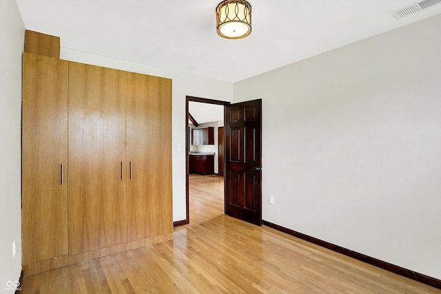 126 E 86th St, Indianapolis, IN 46240 - unfurnished bedroom with light wood finished floors and baseboards