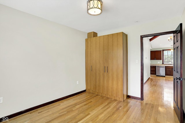 126 E 86th St, Indianapolis, IN 46240 - unfurnished bedroom featuring light wood-type flooring, baseboards, and a sink