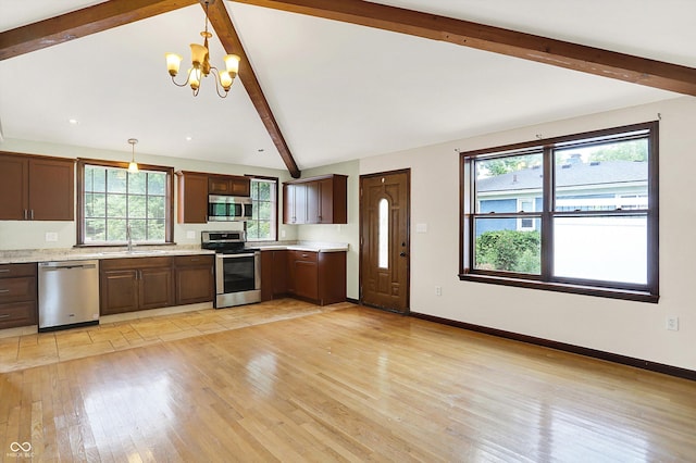 126 E 86th St, Indianapolis, IN 46240 - kitchen featuring stainless steel appliances, light countertops, light wood-style floors, plenty of natural light, and recessed lighting