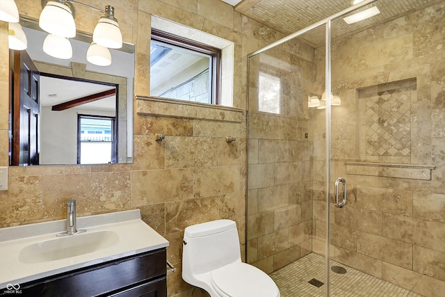 126 E 86th St, Indianapolis, IN 46240 - bathroom with tile walls, vanity, toilet, and a stall shower