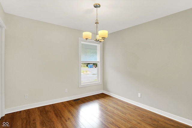 126 E 86th St, Indianapolis, IN 46240 - unfurnished room with a chandelier, wood finished floors, and baseboards