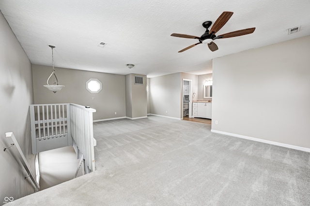 148 S 3rd Ave, Beech Grove, IN 46107 - spare room featuring light carpet, ceiling fan, and baseboards