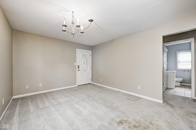 148 S 3rd Ave, Beech Grove, IN 46107 - carpeted empty room with a chandelier and baseboards