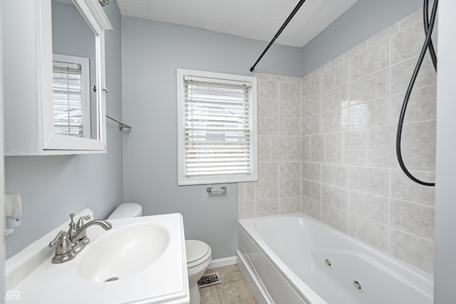 148 S 3rd Ave, Beech Grove, IN 46107 - bathroom with toilet, healthy amount of natural light, a combined bath / shower with jetted tub, and a textured ceiling