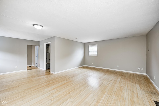 148 S 3rd Ave, Beech Grove, IN 46107 - spare room with light wood-style floors and baseboards