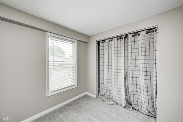 148 S 3rd Ave, Beech Grove, IN 46107 - unfurnished bedroom featuring carpet flooring and baseboards